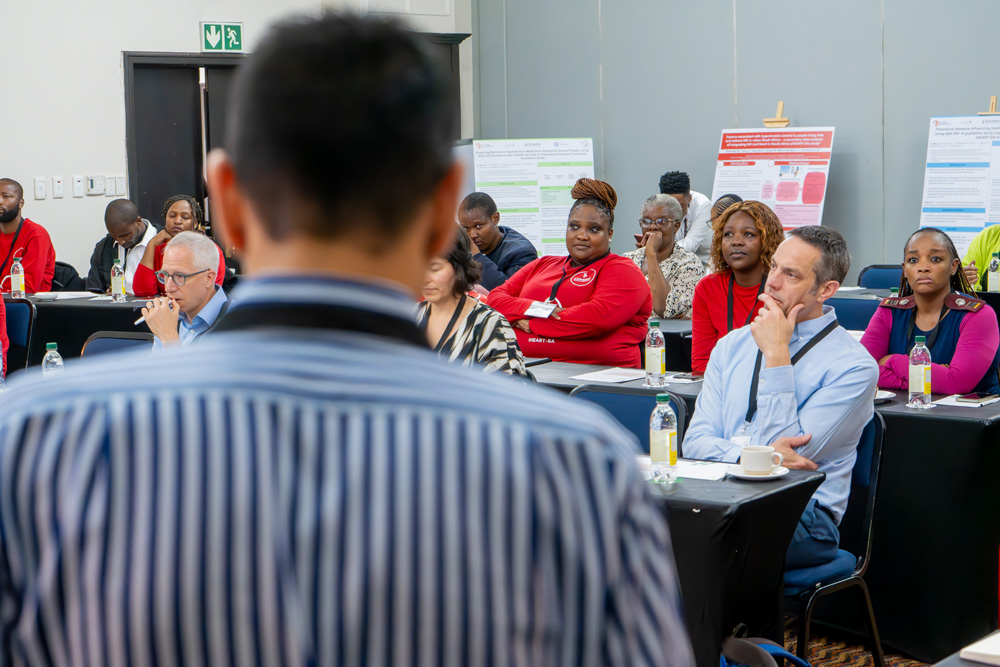 A man presents at a meeting